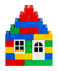 House built of multi colored toy blocks