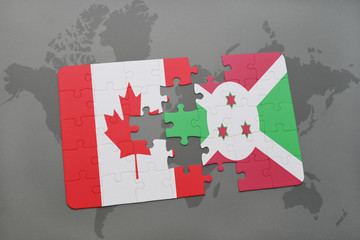 puzzle with the national flag of canada and burundi on a world map background.