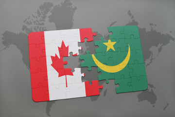 puzzle with the national flag of canada and mauritania on a world map background.