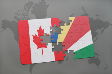 puzzle with the national flag of canada and seychelles on a world map background.