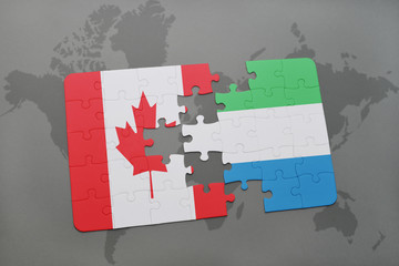 puzzle with the national flag of canada and sierra leone on a world map background.