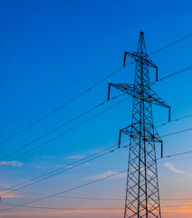 silhouette of power lines on the background of a beautiful sunse