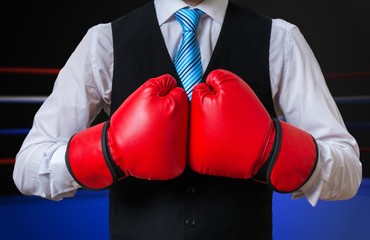 Box manager is fighting and boxing in ring.