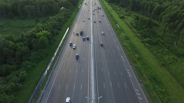 Aerial View of Traffic on a Motorway Ring Road Through a Wooded Area