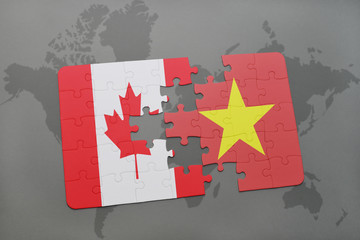 puzzle with the national flag of canada and vietnam on a world map background.