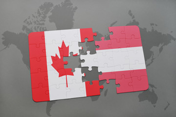 puzzle with the national flag of canada and austria on a world map background.
