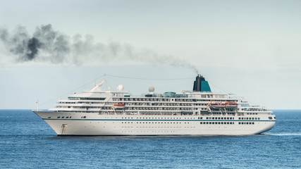 Fototapeta na wymiar Anchored cruise ship starting engines