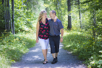 Happy adult couple in park