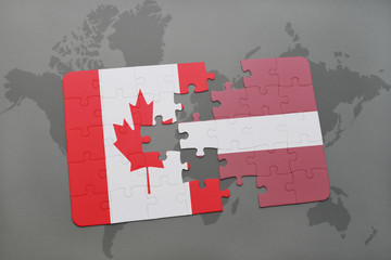 puzzle with the national flag of canada and latvia on a world map background.