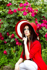 sexy woman in red hat with rose