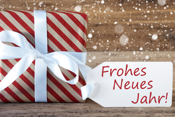 Fototapeta na wymiar Present With Snowflakes, Text Neues Jahr Means Happy New Year