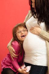 pregnant woman with her daughter