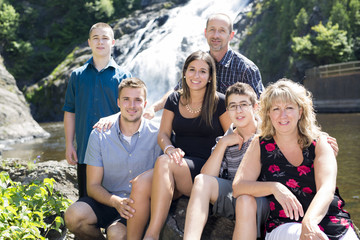 family waterfall having great time