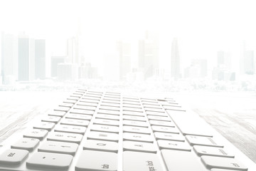 Keyboard on abstract city background