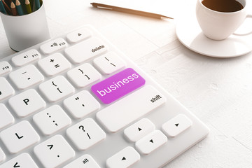 white keyboard with purple business button