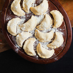Raw Russian traditional vareniki with cabbage