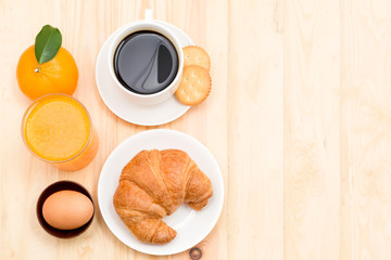 Delicious continental breakfast with fresh flaky croissants, assorted preserves, orange juice