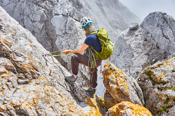 woman climbing in mountains of Austria / Extreme Sports in the Alps