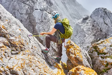 Fotobehang woman climbing in mountains of Austria / Extreme Sports in the Alps © marako85