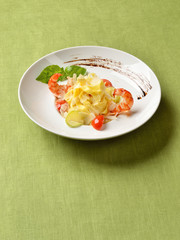 Fettuccine with grilled cherry tomatoes, shrimps and Parmesan ch