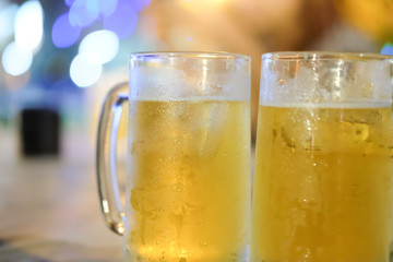 Glass of beer against barrels