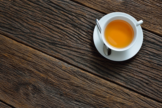 Top view of a cup of tea on wooden table


