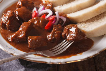 Hot Czech beef goulash with Knodel close-up. horizontal
