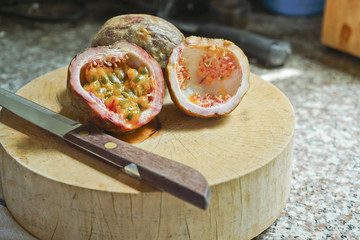 Passion fruit on a cutting board.