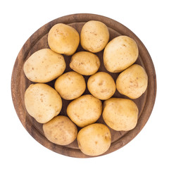 Young potatoes on a cutting board on white background close-up.