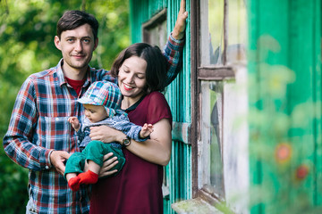 Obraz premium young family with a child on the nature