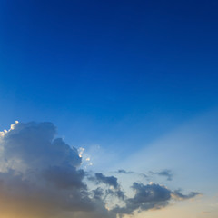 light of sunbeams through clouds, light rays on dramatic sunset