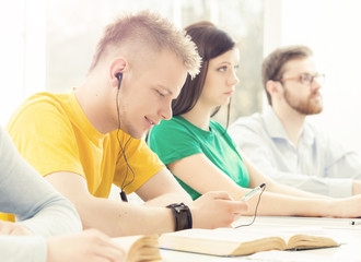 Young and smart students learning in a classroom