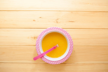 Healthy natural eco baby lure. Soup of squash, carrot, onion, ca