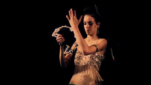 female percussion drummer performing with bongos