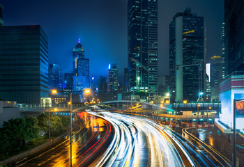 Fototapeta premium blurred traffic in downtown district,hong kong,china.Chinese characters on road are all traffic roadmarking.