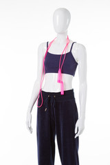 Mannequin with pink skipping rope.