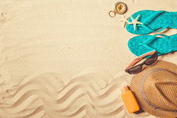 Fototapeta na wymiar shoes and hat on the beach