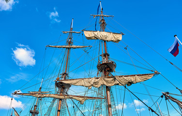 Masts of the frigate against blue sky