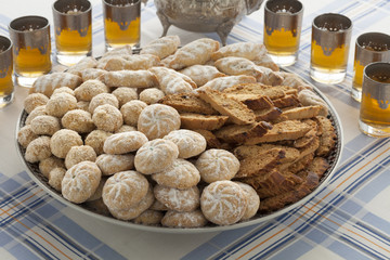 Traditional variety of Moroccan cookies with tea - obrazy, fototapety, plakaty