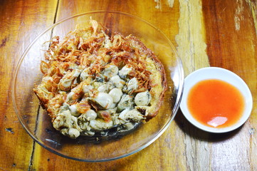 omelet topping oyster with chili sauce