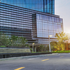 city empty traffic road with cityscape in background