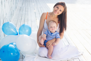 Young mother and son with balloons