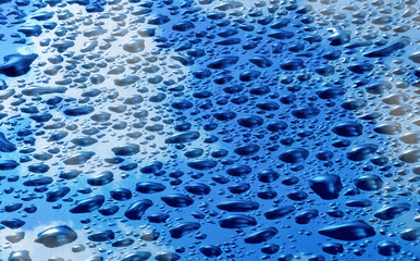 image of blue surface with drops close-up