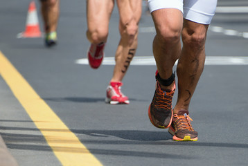 Fototapeta na wymiar Marathon competition during an ironman the numbers on the leg