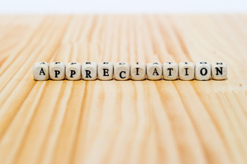 APPRECIATION on wooden background
