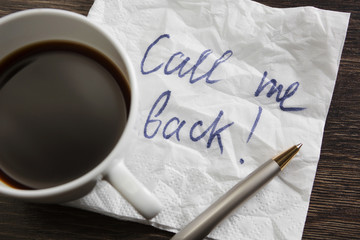 Coffee cup and napkin with message