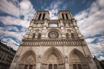 Fototapeta na wymiar Notre Dame de Paris. France. Ancient catholic cathedral on the quay of a river Seine. Famous touristic architecture landmark in spring 