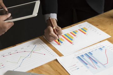 businessman in suit analyze market analysis business chart