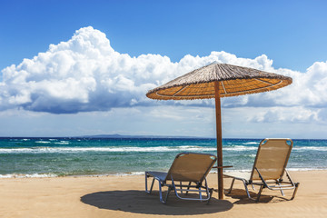 Beach chairs under a canopy. Zakynthos. Greece