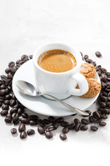 cup of fresh espresso and cookies on white background, vertical
